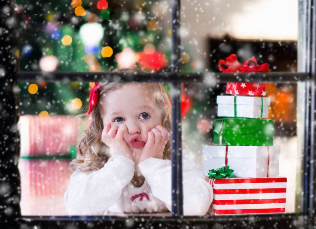 hopeful girl in xmas window