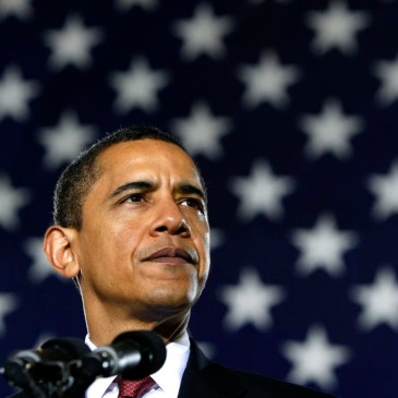 Obama in front of stars of flag